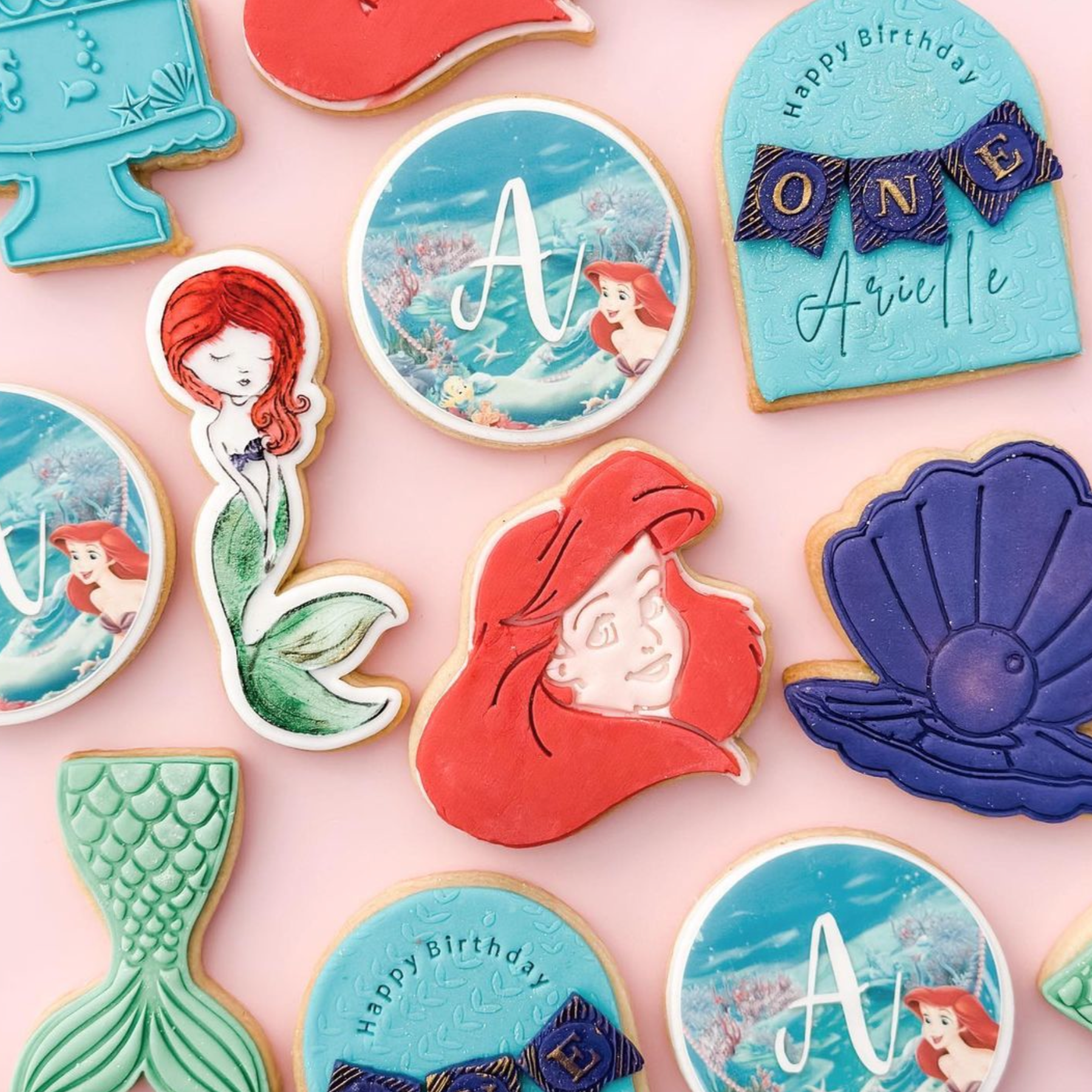 mermaid cookies on pink background