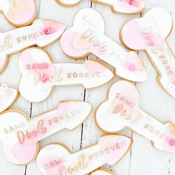 penis shape watercolour cookies with same dickforever embossed into them on a white background